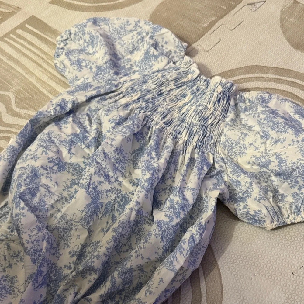 Smocked Puff-Sleeve Baby Romper in Blue Toile